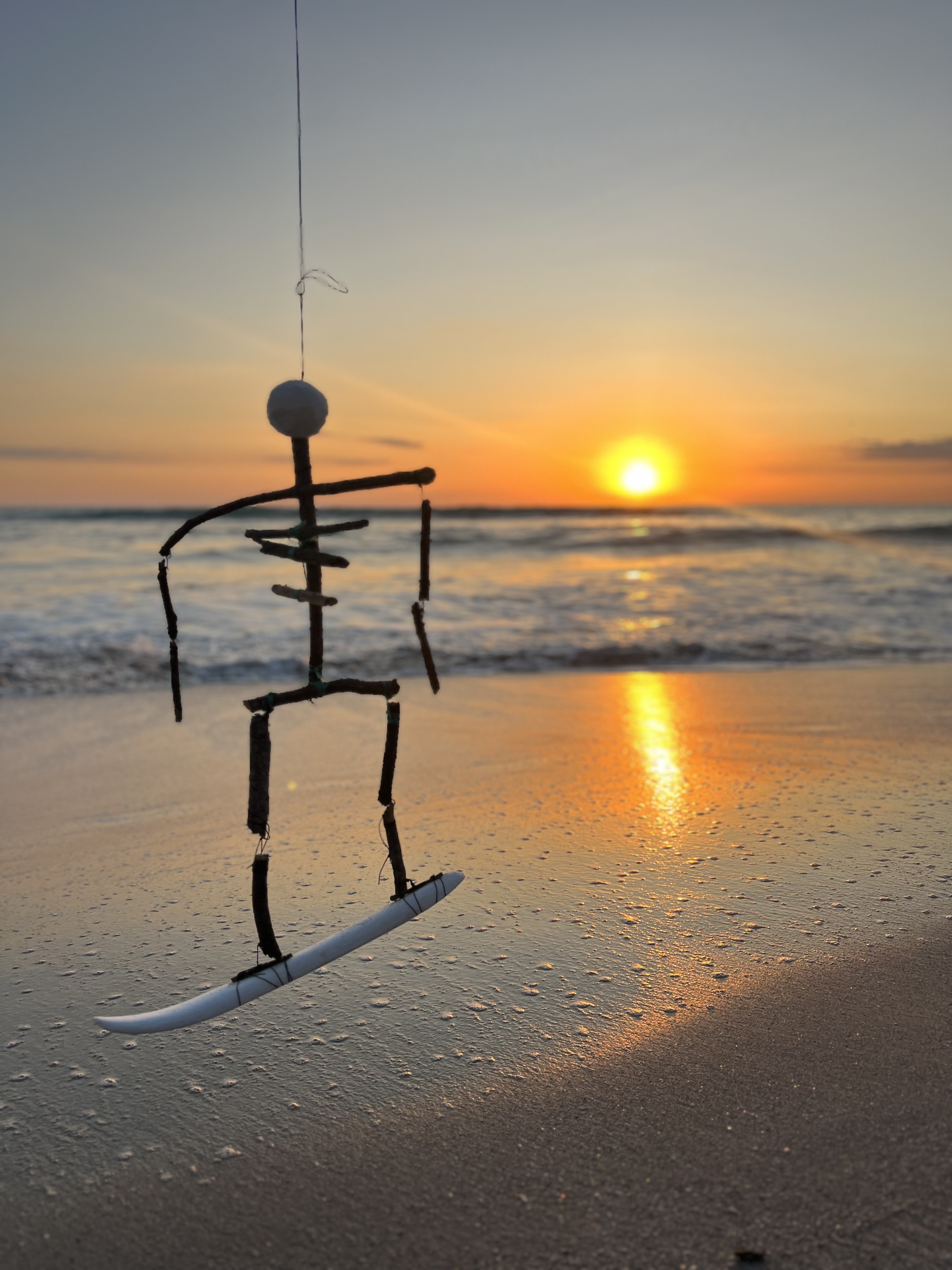 Yoga figure silhouette at sunset on the beach